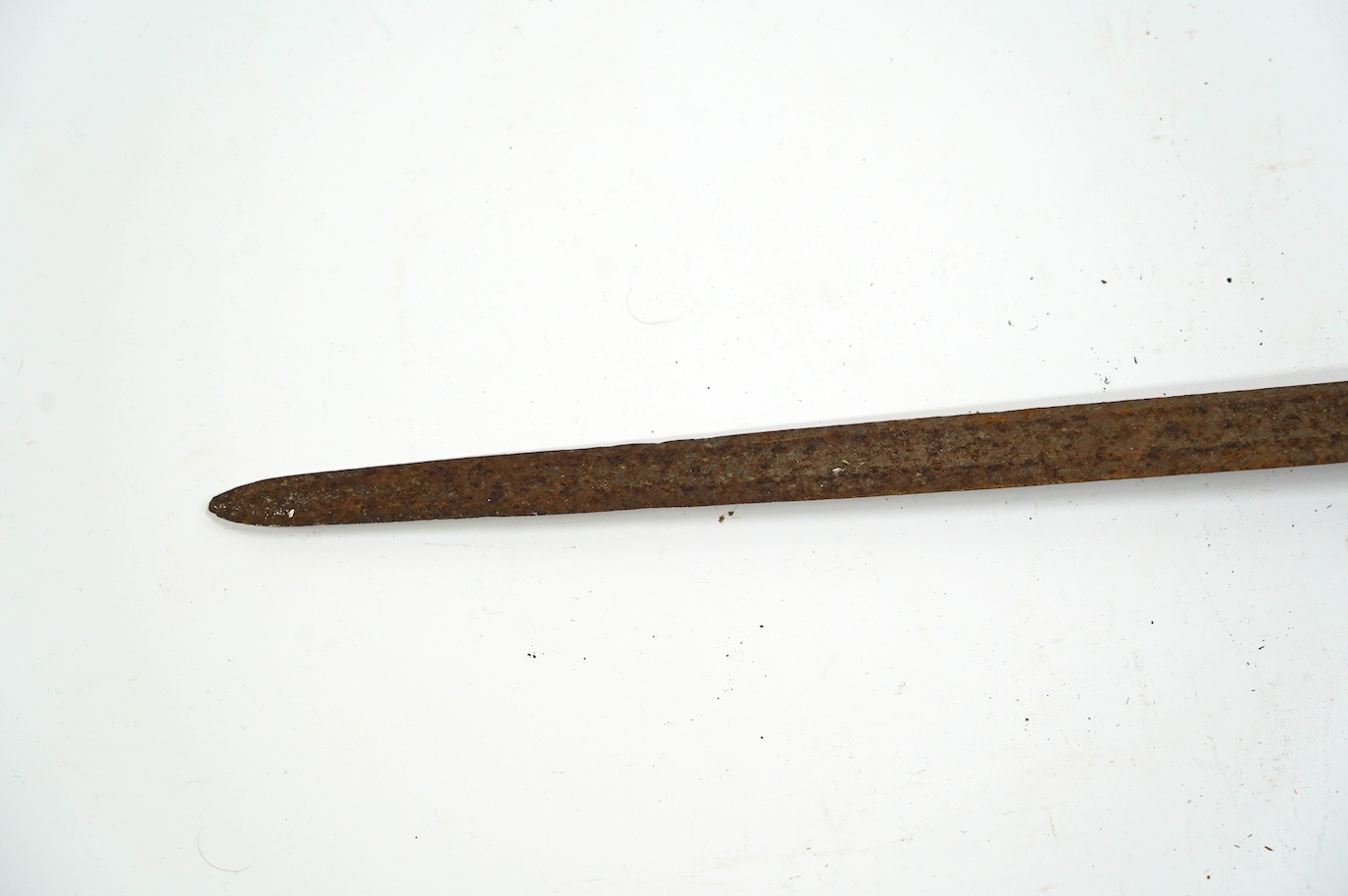 A British cavalry trooper’s sword, c.1750, straight single edged fullered blade, regulation iron hilt, with bun shaped pommel, blade 91.5cm. Condition - fair, rusted overall and grip missing